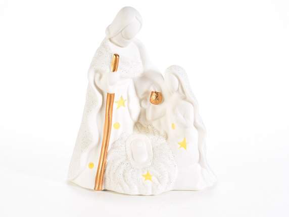 White ceramic nativity scene with golden details, glitter an