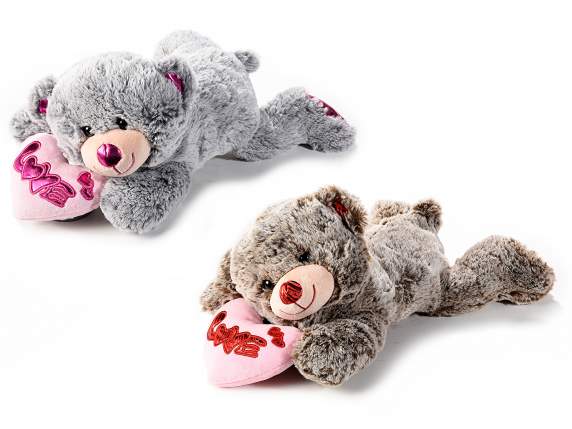 Lying teddy bear with padded heart