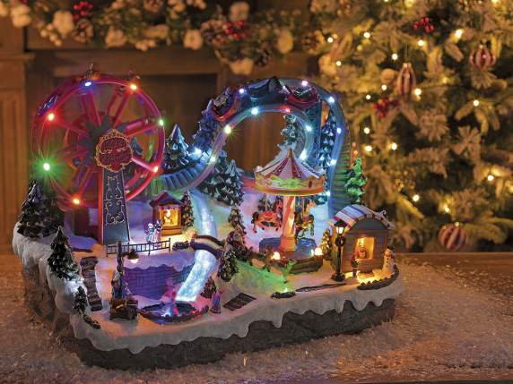 Parc avec manèges en résine, lumières multicolores, musique
