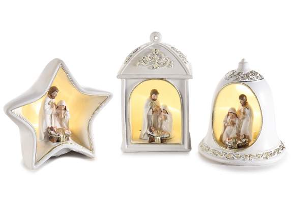 Nativity scene in white resin and golden details and led lig