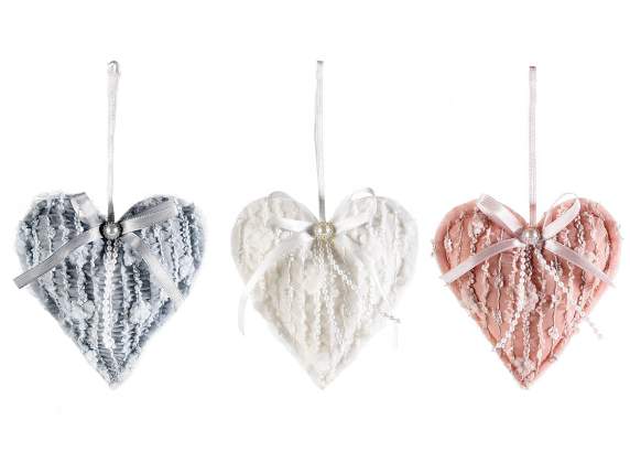 Padded heart in embroidered fabric with bow to hang
