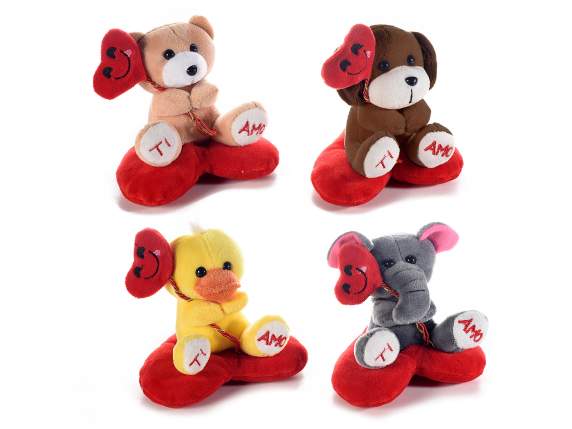 Peluche su cuscino a cuore con palloncino e scritta Ti amo