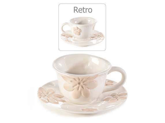 Porcelain cup and saucer with embossed flower decorations