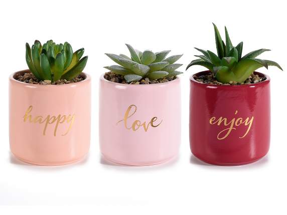Vase en céramique avec plante artificielle et écriture dorée