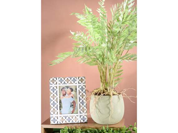 Raw colored porcelain vase with black interior