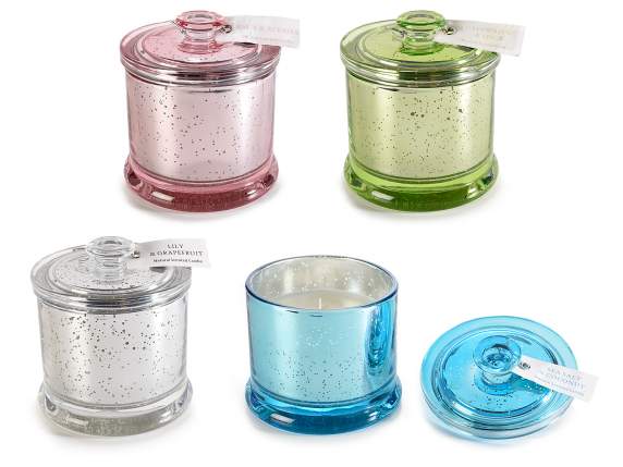 Scented candle in colored glass jar with lid