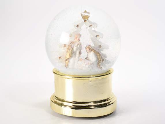Snow globe music box with shiny golden base Nativity scene