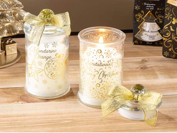 Vela perfumada en tarro de cristal navideño con tapa.