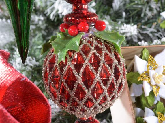 Glass decoration with berries and holly leaves to hang