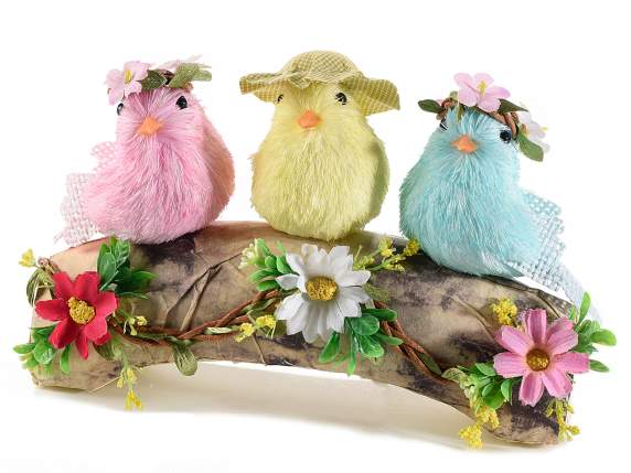 Trio of birds in colored natural fiber on a log