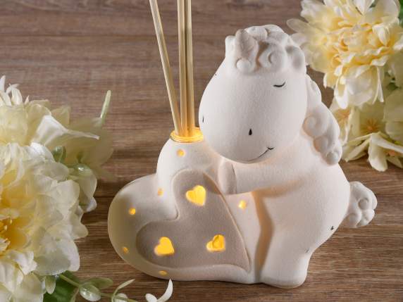 Unicorn in opaque porcelain with led and stick for perfuming