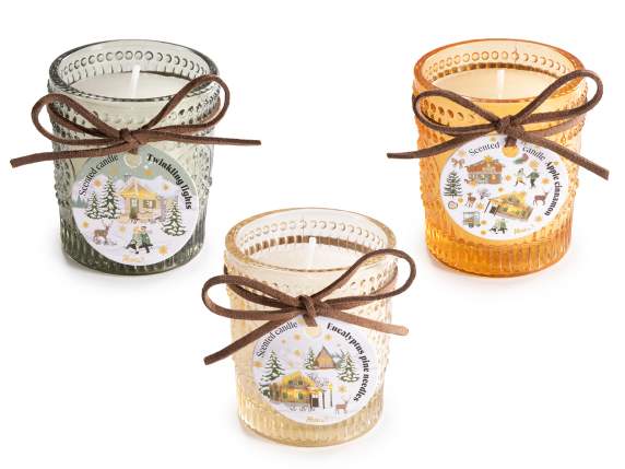 Vela perfumada en un frasco de vidrio con un lazo.