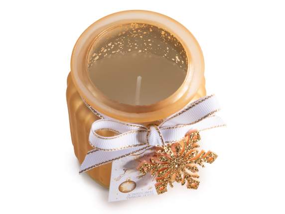 Vela perfumada en tarro de cristal con lazo y decoración.