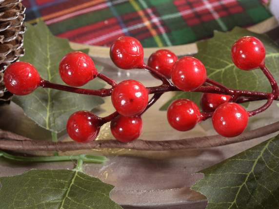 Garland festoon with snowy pine cones and red berries