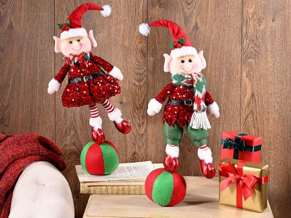 Christmas elf with sequin dress on fabric ball