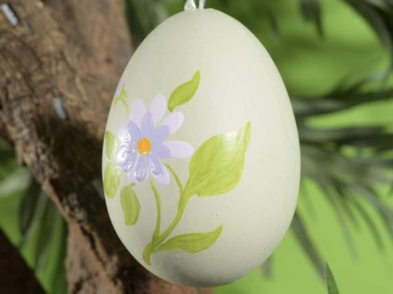 Display of 12 hand-painted plastic eggs to hang
