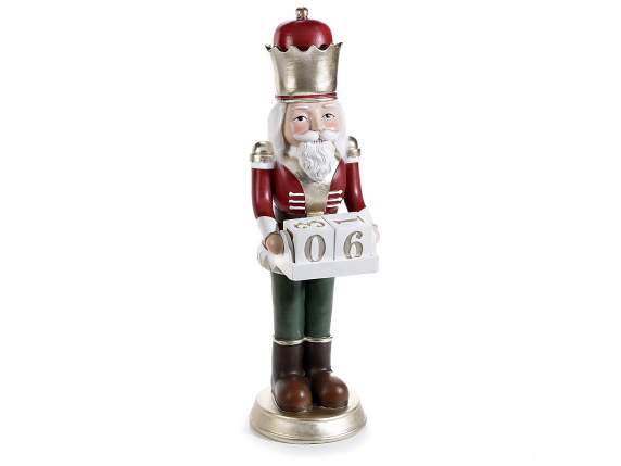 Resin nutcracker with gold details and calendar