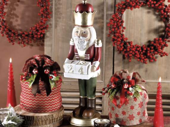 Resin nutcracker with gold details and calendar