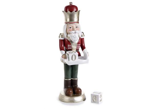 Resin nutcracker with gold details and calendar