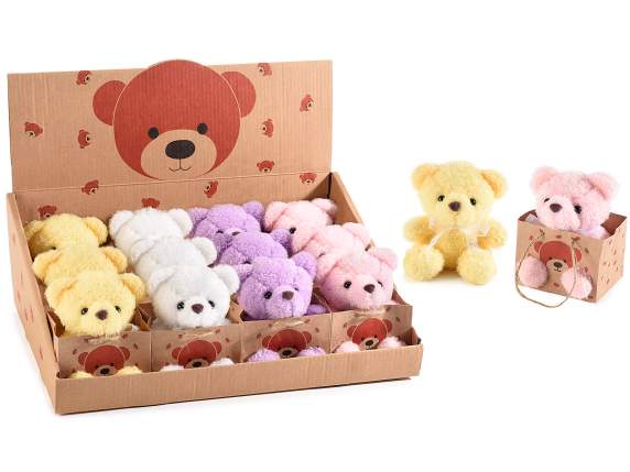 Colorful teddy bear in a paper bag with handles