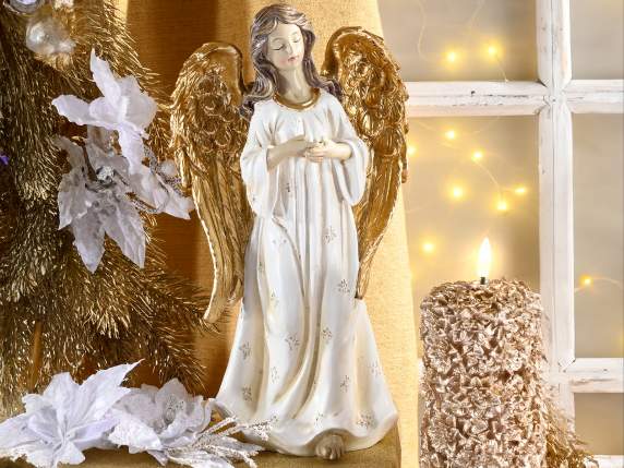 Colored resin angel with golden wings to be placed