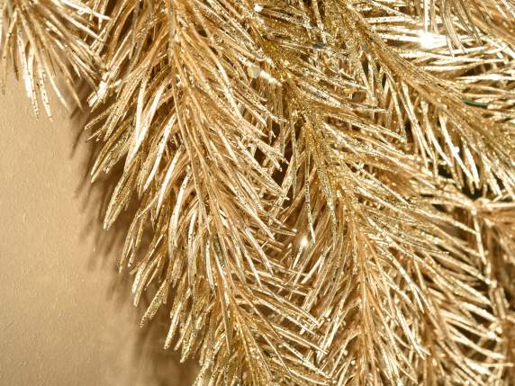 Gold-colored artificial fir branch with glitter