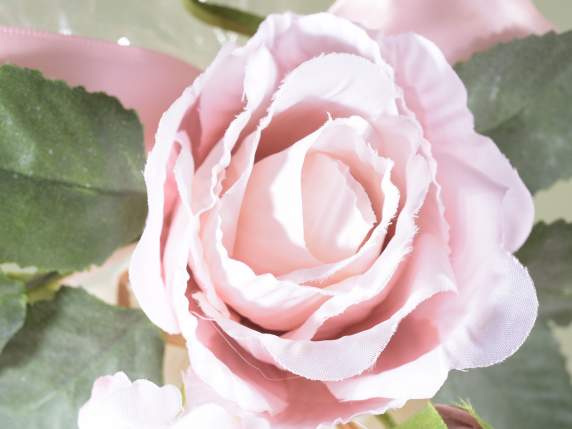 Sprig of rose in pink fabric with bud and small flowers