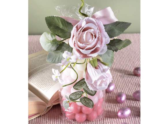 Sprig of rose in pink fabric with bud and small flowers