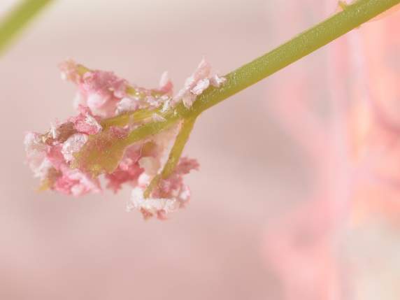 Artificial bouquet of peach blossoms with leaves and berries