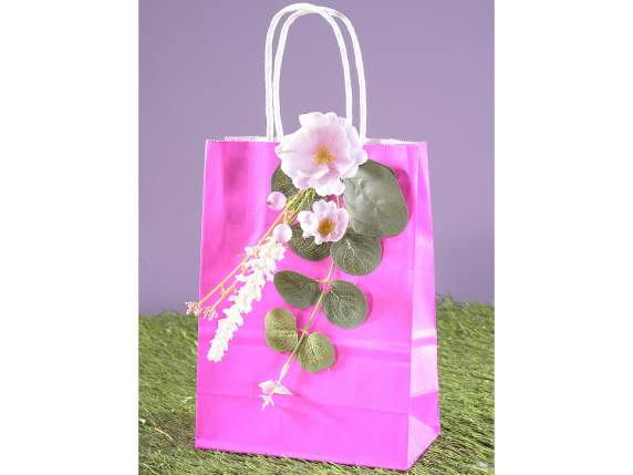 Artificial bouquet of peach blossoms with leaves and berries