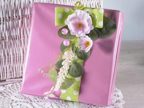 Artificial bouquet of peach blossoms with leaves and berries