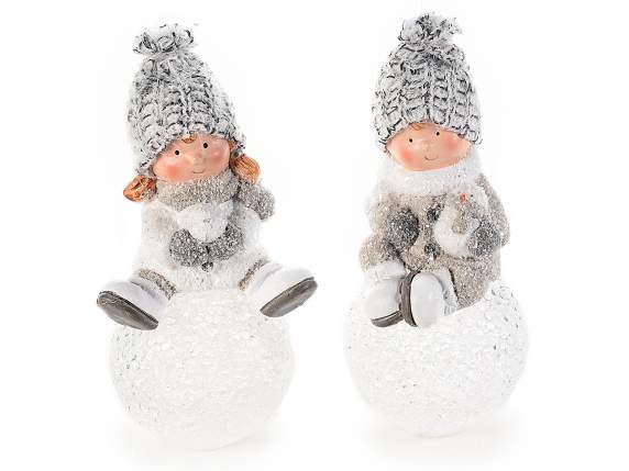 Ceramic boy-girl on snowball with LED light and hat