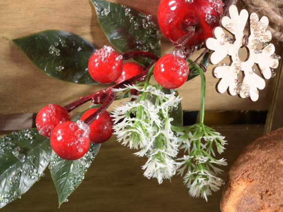 Snowy bouquet with red berries, wood decoration and bow