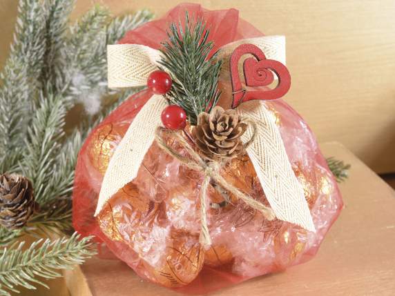 Bouquet with pine, berries and wooden decorations