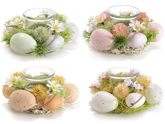 Centerpiece with colored eggs and glass candle holder
