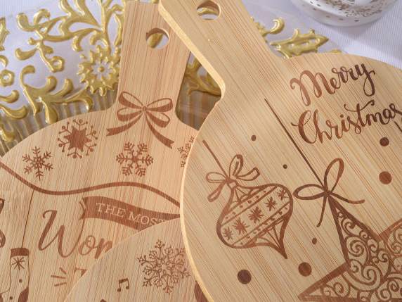 Wooden cutting board decorated with gilded edge in display
