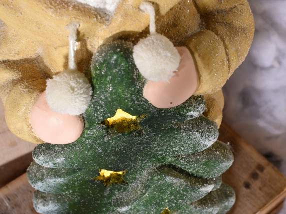 Child in colored ceramic with fur hat and LED lights