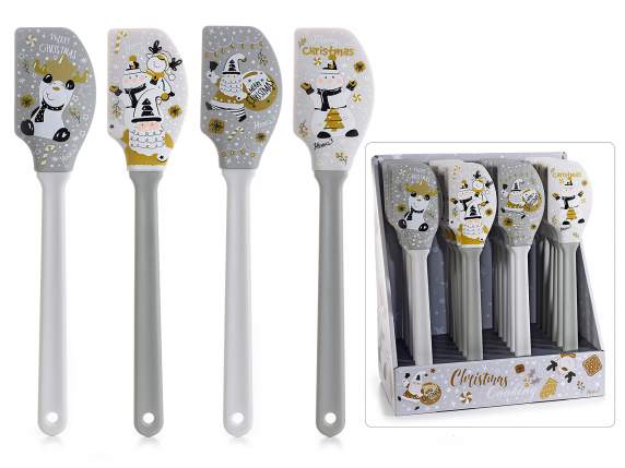 Cake spatula in silicone with Santa Gang decorations on di