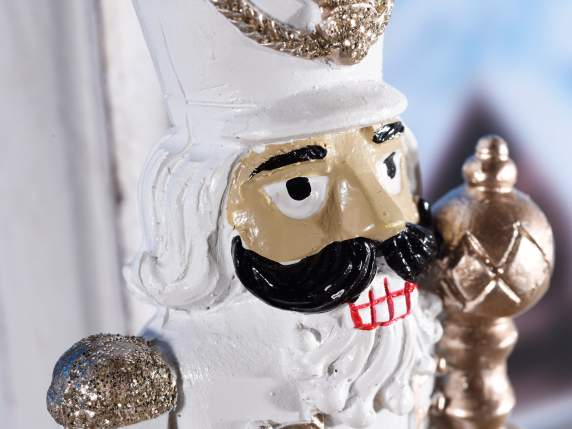Resin nutcracker with glitter details to be placed on
