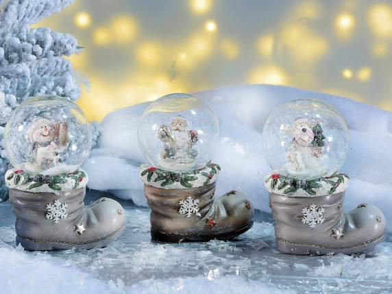 Christmas snowball on resin boot on display