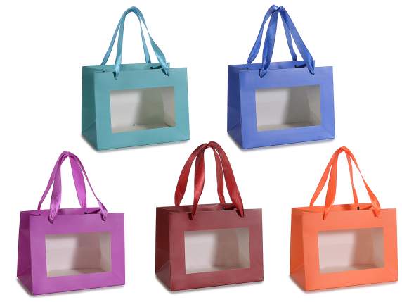 Small colored paper bag with fabric handles and window