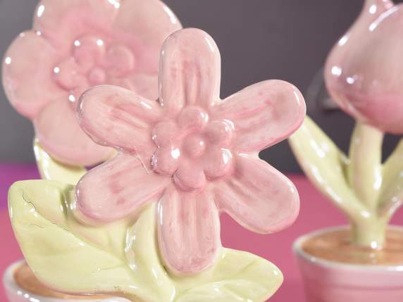Decorative flowers in pearly glossy ceramic to be placed on