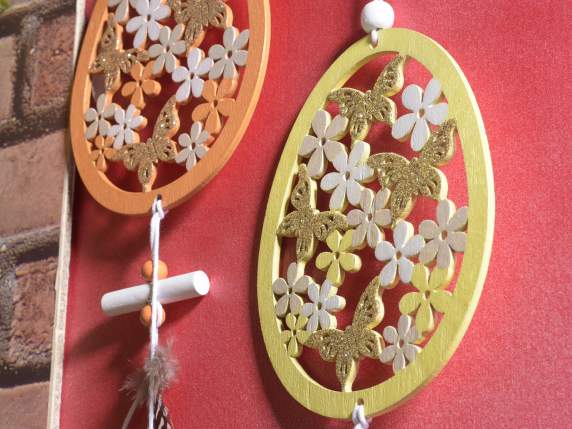 Colored wooden decoration with eggs and feathers to hang