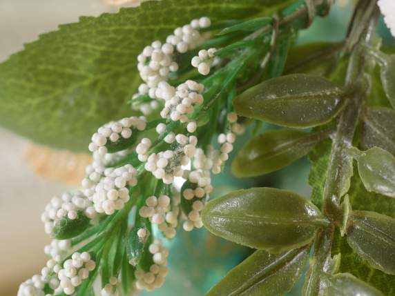 Bouquet of colored eggs with leaves, flowers and ribbon
