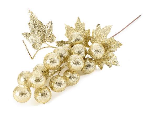 Vine branch with berries and gold glittery leaves