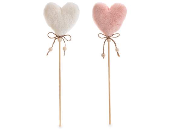 Soft eco-fur heart with rope bow on wooden stick