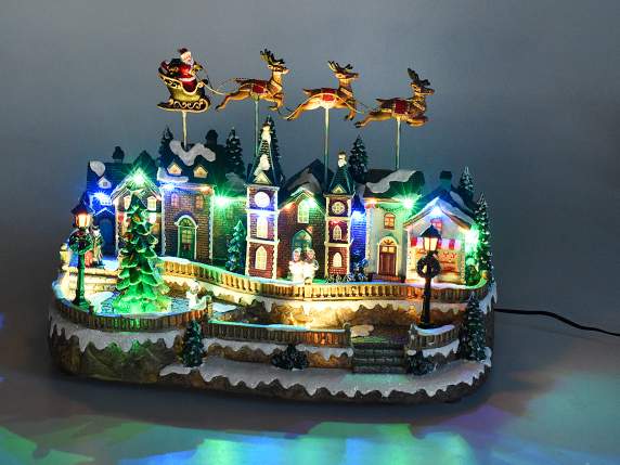 Christmas landscape with movement, multicolored lights and m