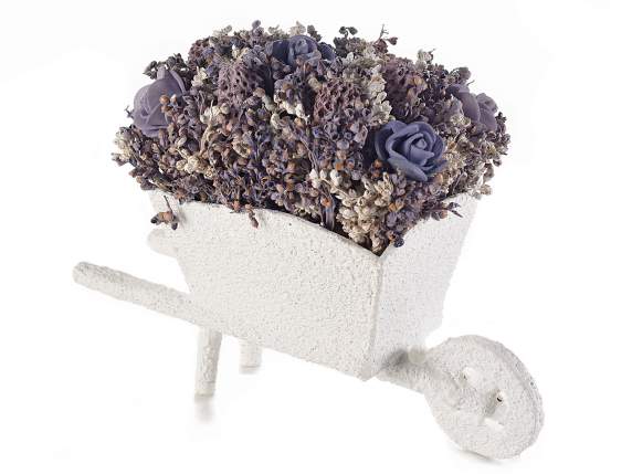 Wheelbarrow with lavender flowers and artificial roses