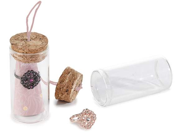 Metal ring with rhinestones in test tube