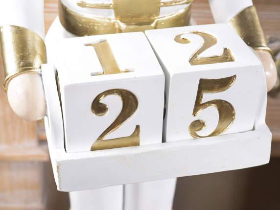 Resin nutcracker with golden details and calendar